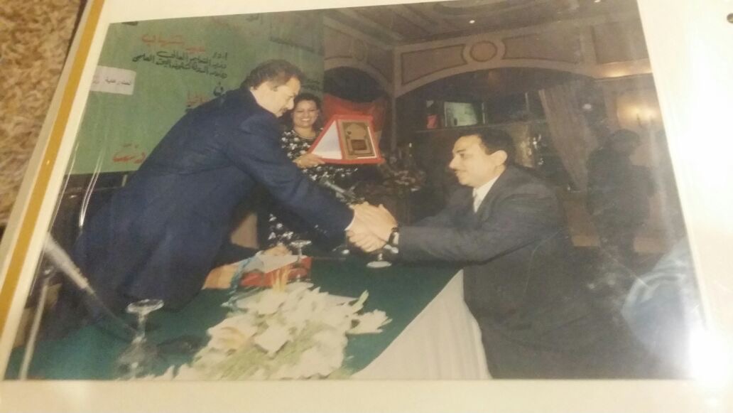 Receiving an innovation shield during an official honouring ceremony